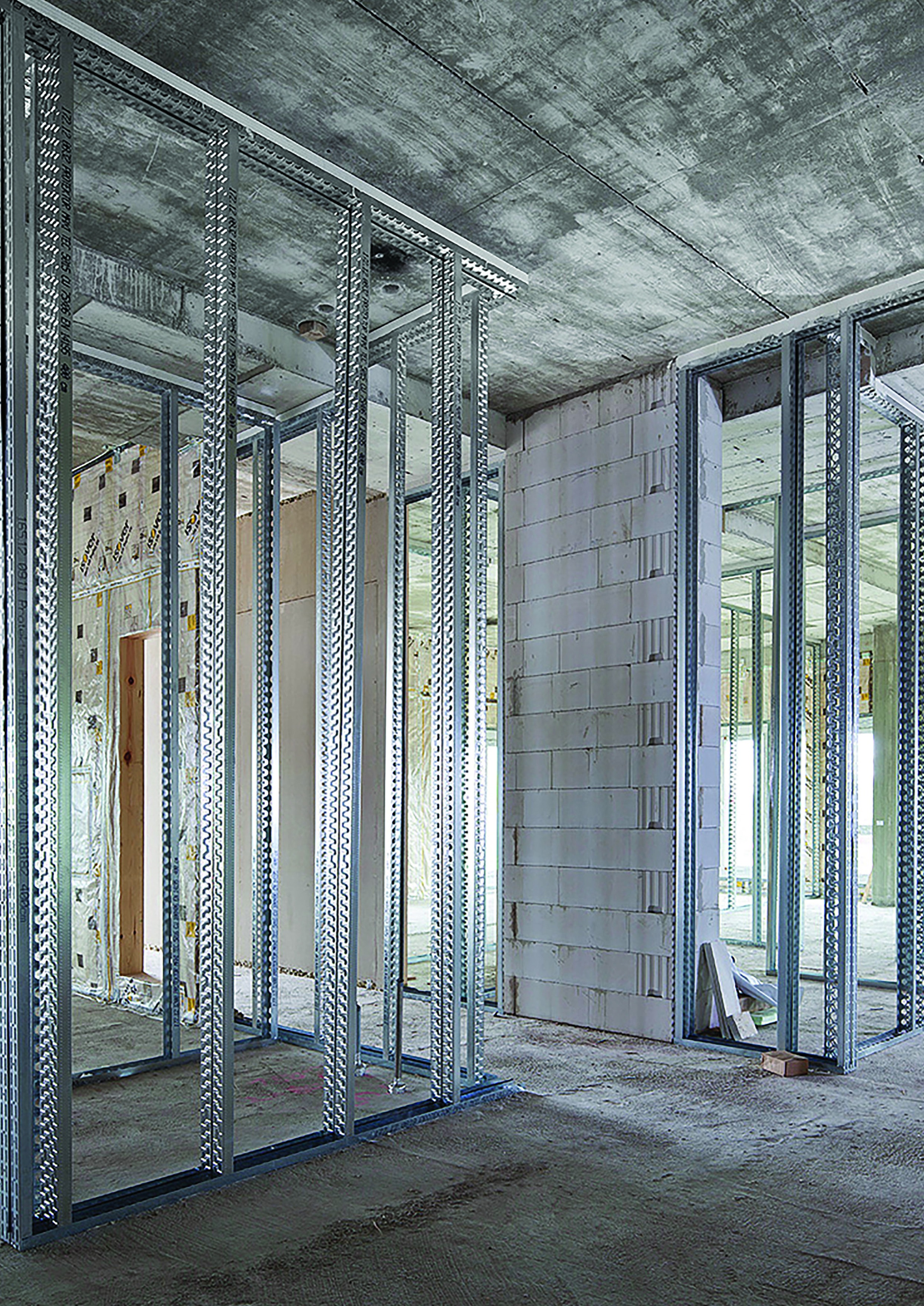 Metal stud framework for an internal partition wall in a refurbishment project